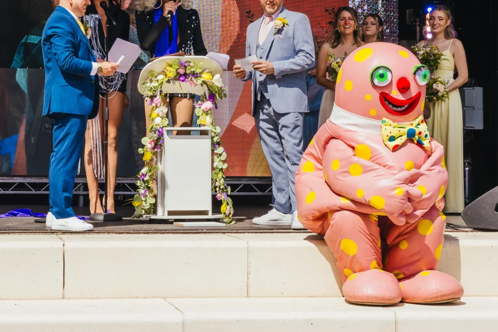 Mr Blobby sits on steps like a naughty child during couples vows at binks yard in Nottingham