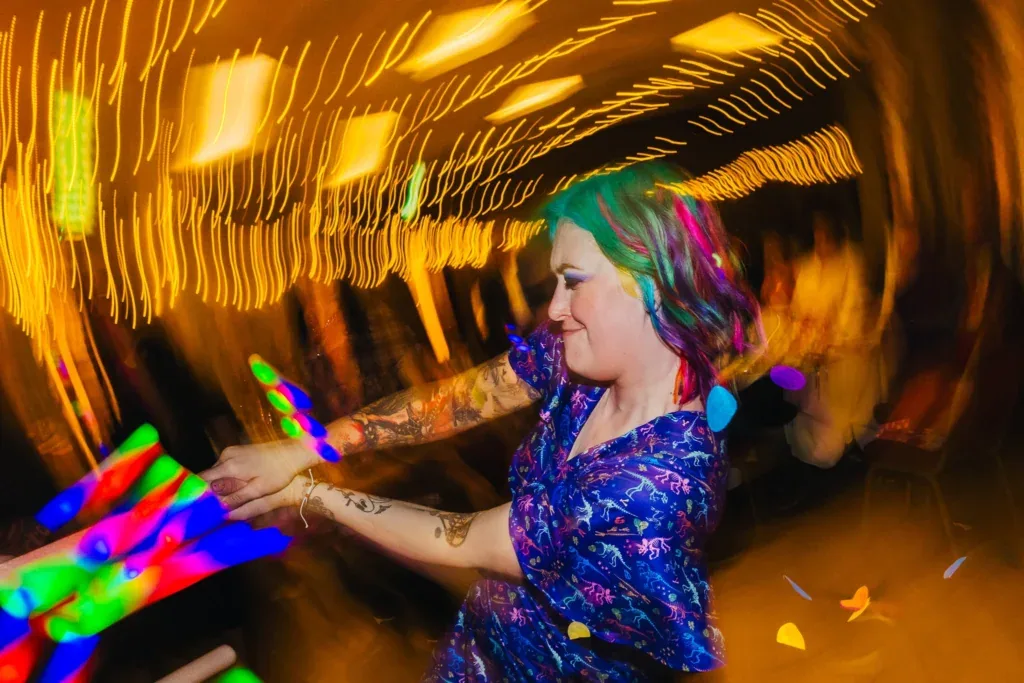 Guest dancing with glow sticks