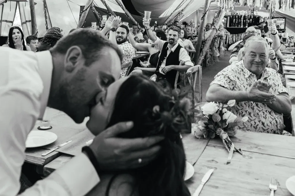 Couple kissing during speeches at The Old Vicarage