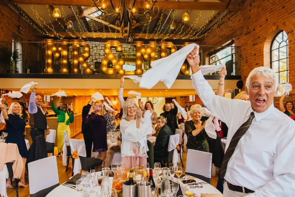 Guests waving napkins at Carriage Hall